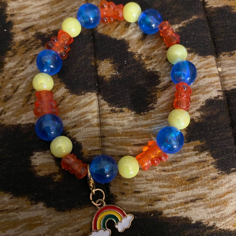Handcrafted beaded bracelet with gummy bears and a rainbow charm